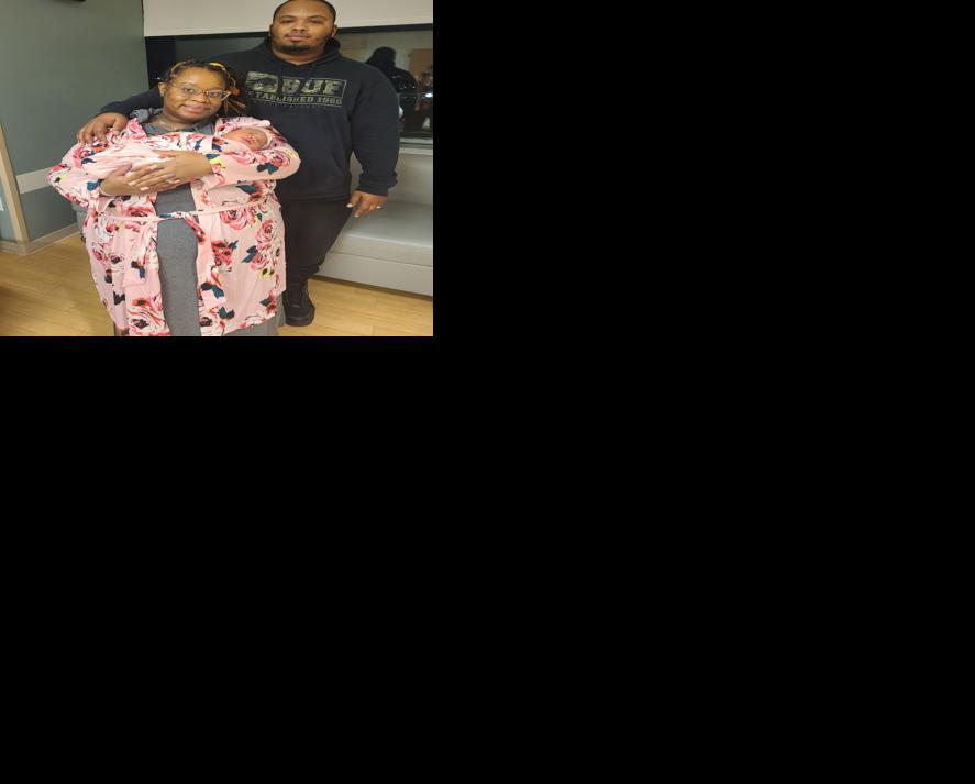 Erica and Davon Thomas with their baby girl, Devynn
