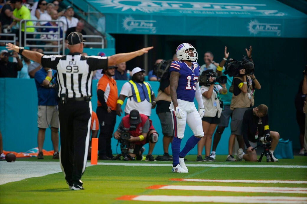 Buffalo Bills wide receiver Gabriel Davis (13) carries a football as he  warms up on the field before an NFL football game against the Miami  Dolphins, Sunday, Sept. 19, 2021, in Miami