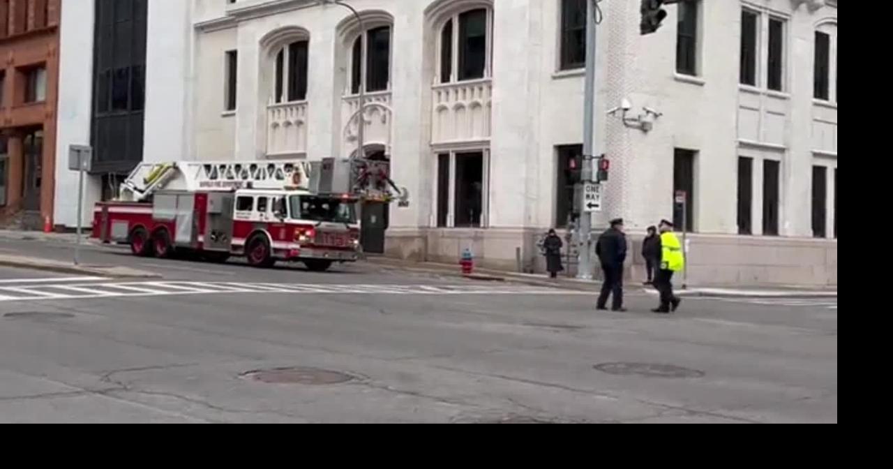 Ladder trucks set up on Church Street for funeral procession for Jason Arno