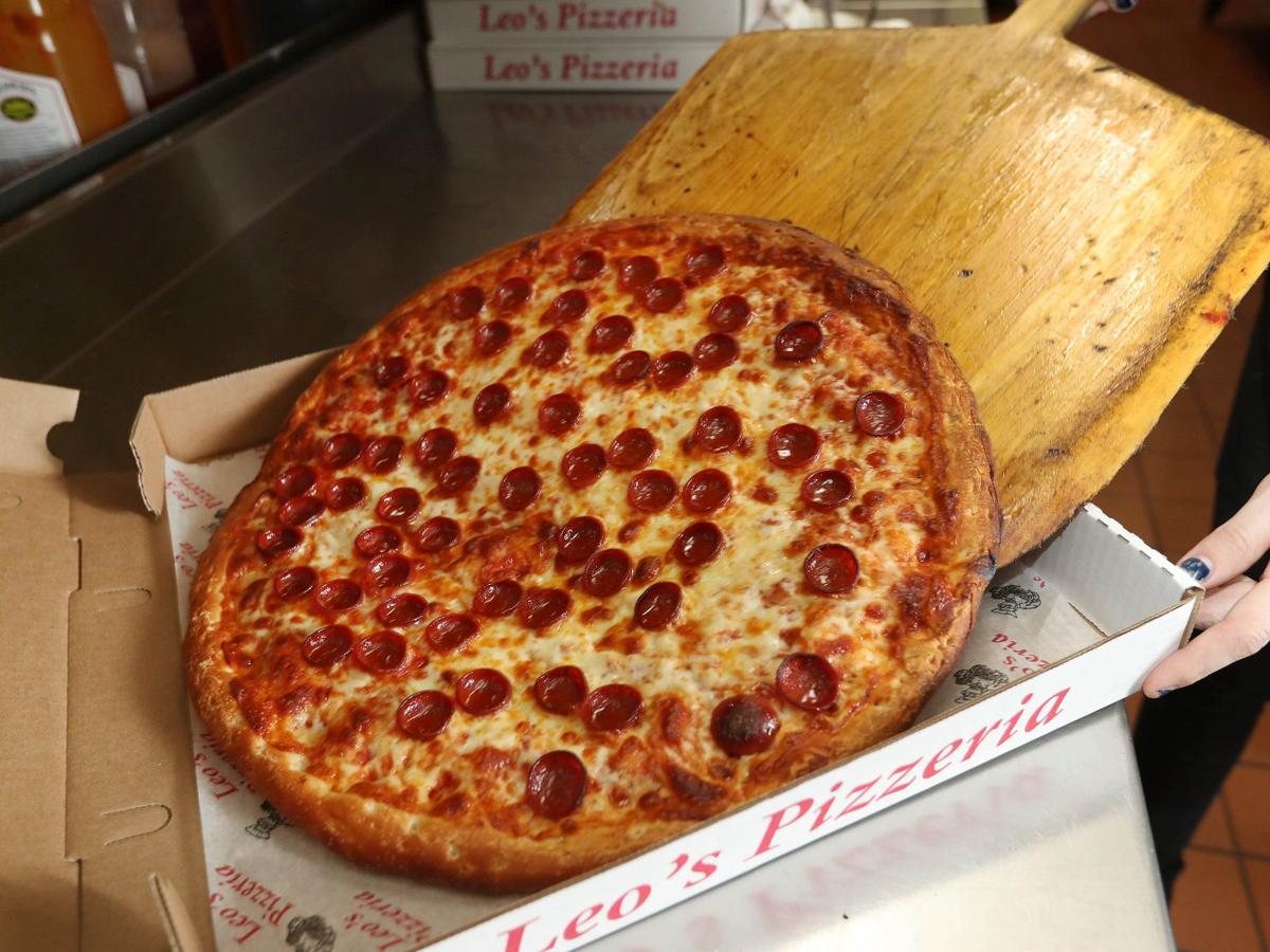 Sit down, have a slice and a drink at Leo
