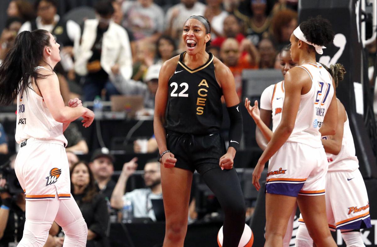 Forward A'ja Wilson reacts with teammate Forward Candace Parker of