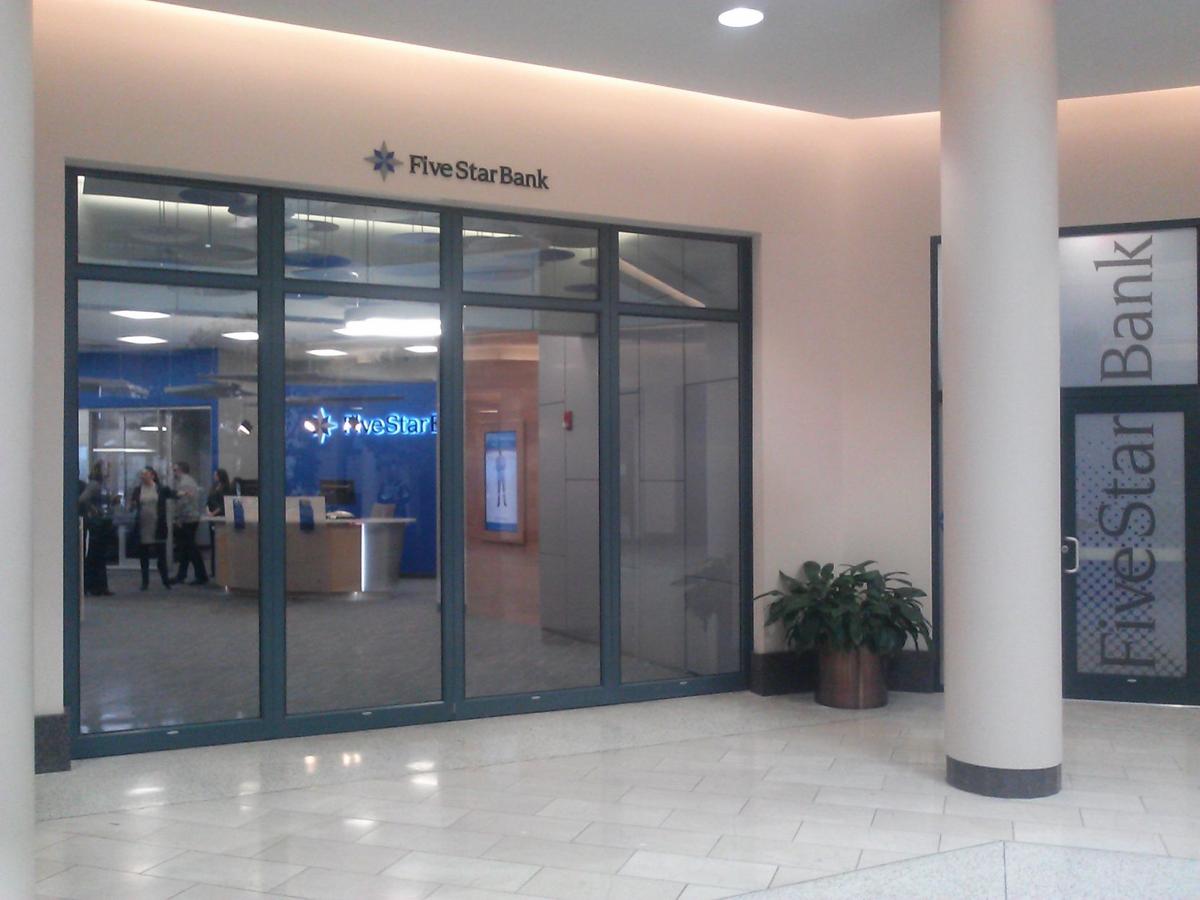 Five Star Bank plants flag with downtown branch