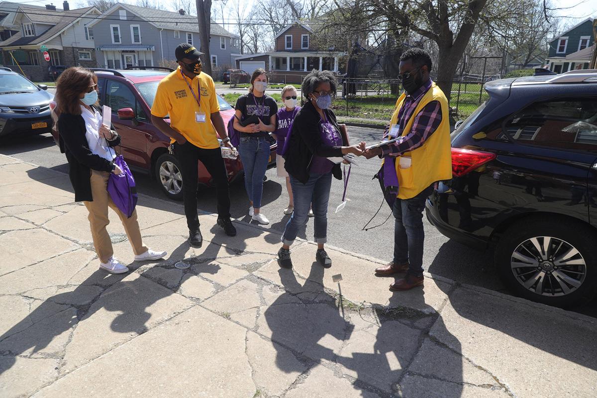 Volunteers prepare to go door-to-door