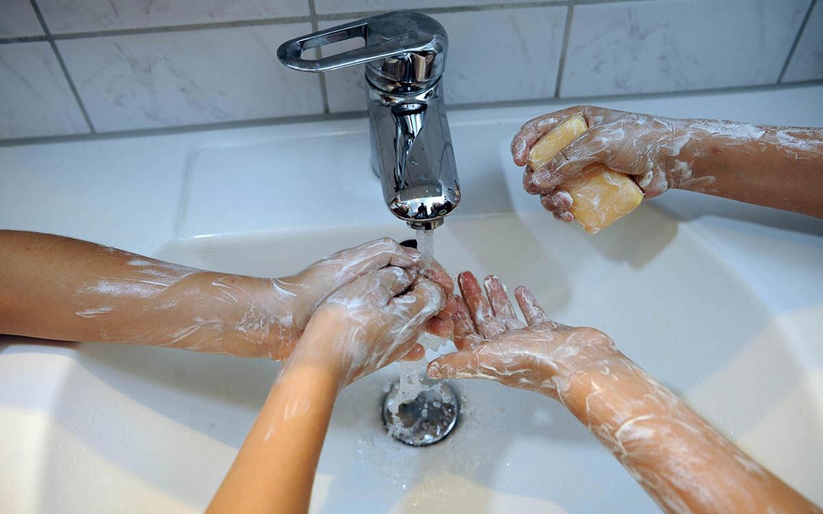 Hand washing Children wash their hands with soap coronavirus