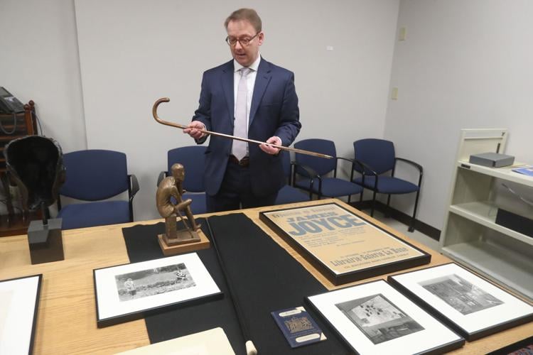 James Maynard, PhD. curator of the Poetry Collection University Libraries shows cane owned by  James Joyce