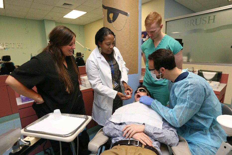 University at Buffalo dentist's mission Give kids a smile