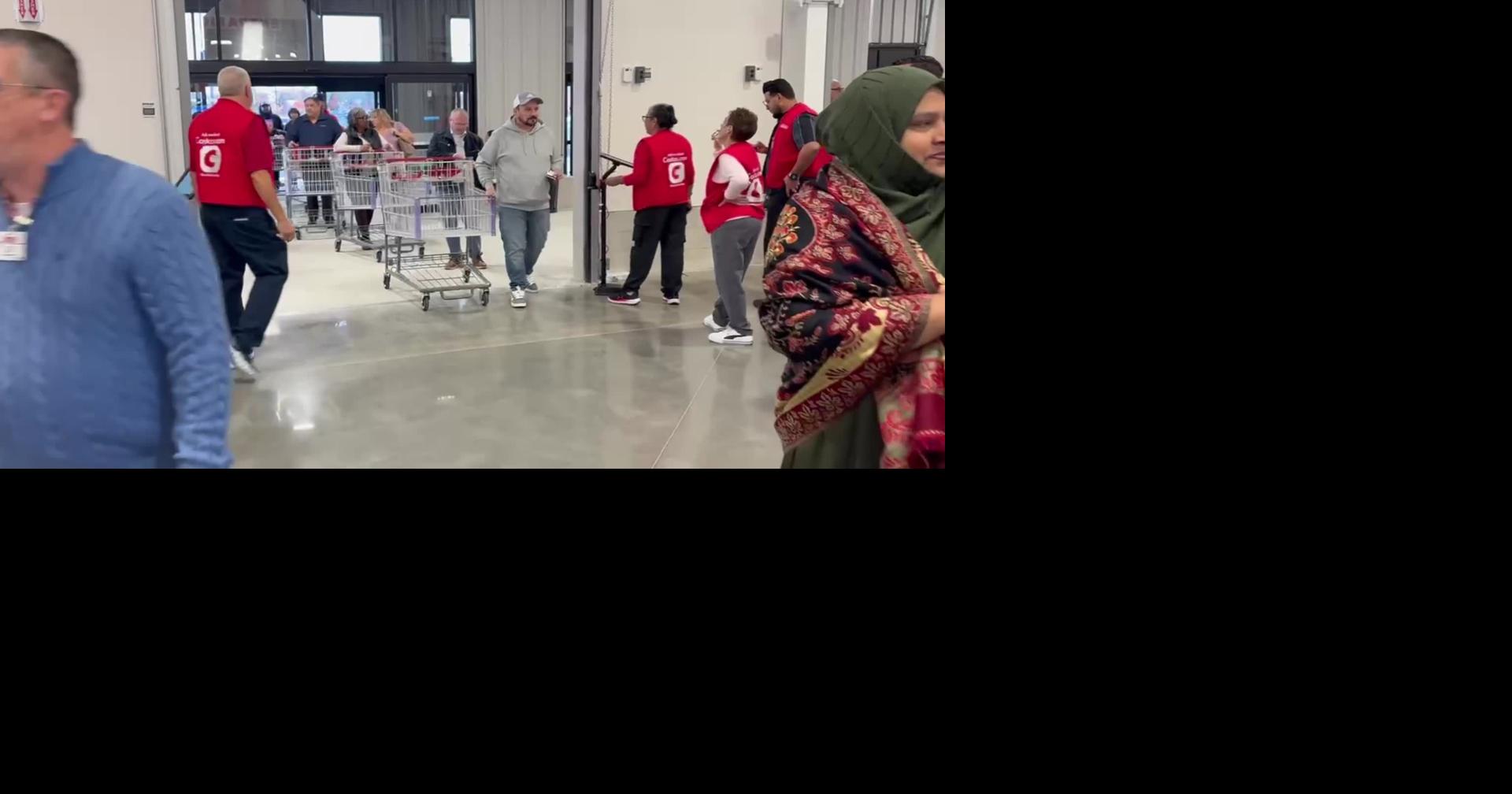 People stream into Costco during grand opening