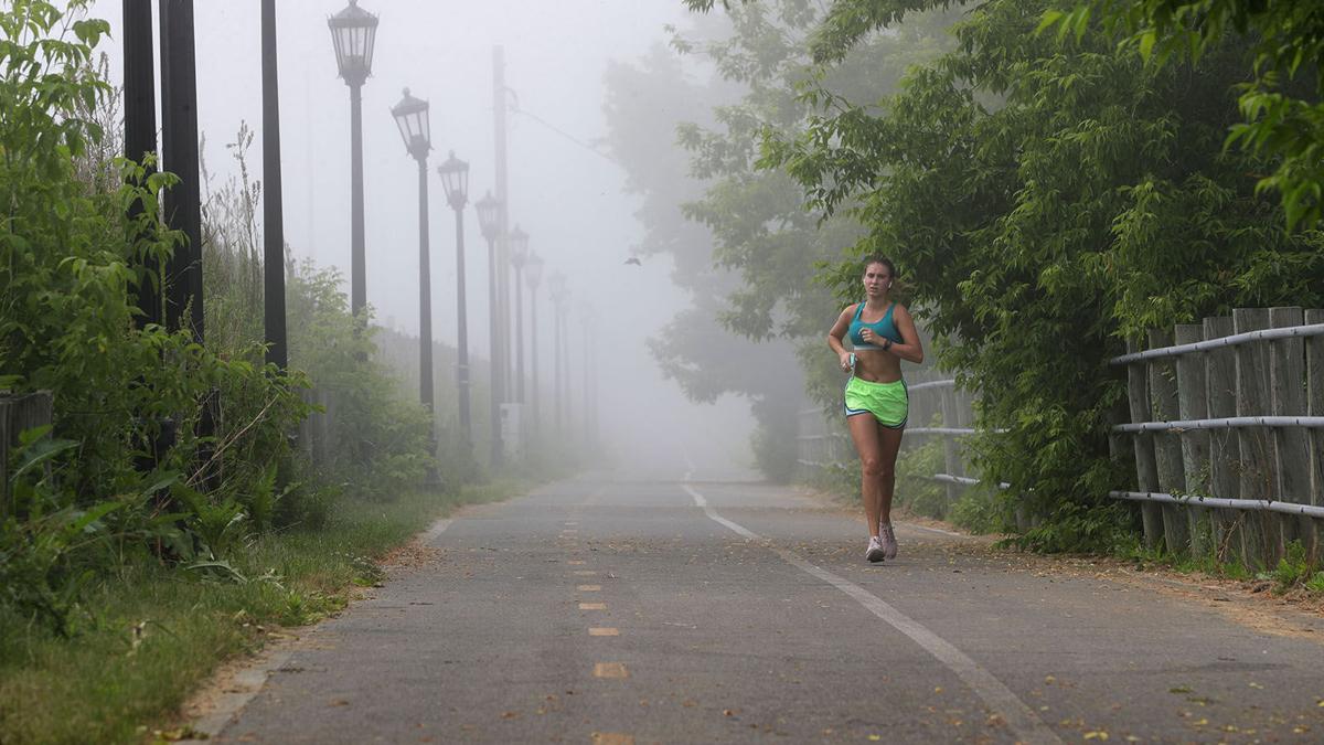 Manke jogs through fog on Shoreline Trail