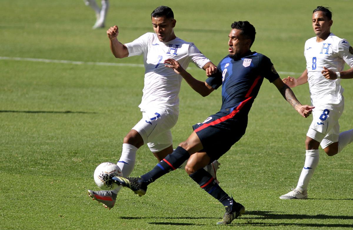 United States' Jesus Ferreira, right, and Honduras' Jose Reyes, left, vie for the ball during their CONCACAF Olympic Qualifying Semifinal football match at the Jalisco Stadium in Guadalajara, Mexico, on March 28, 2021.