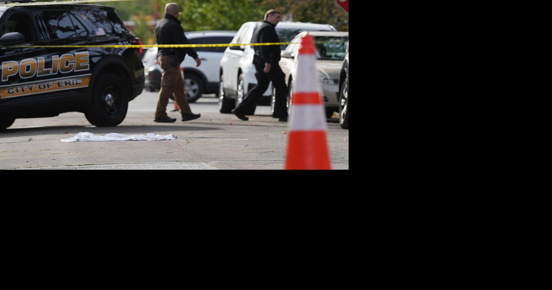 Erie Bureau of Police investigate the scene where multiple people were killed in a reported shooting in and around a home at 722