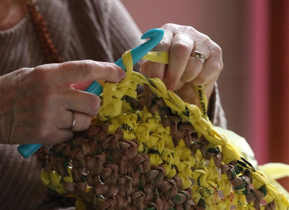 Recycling plastic bags into sleeping mats for the homeless