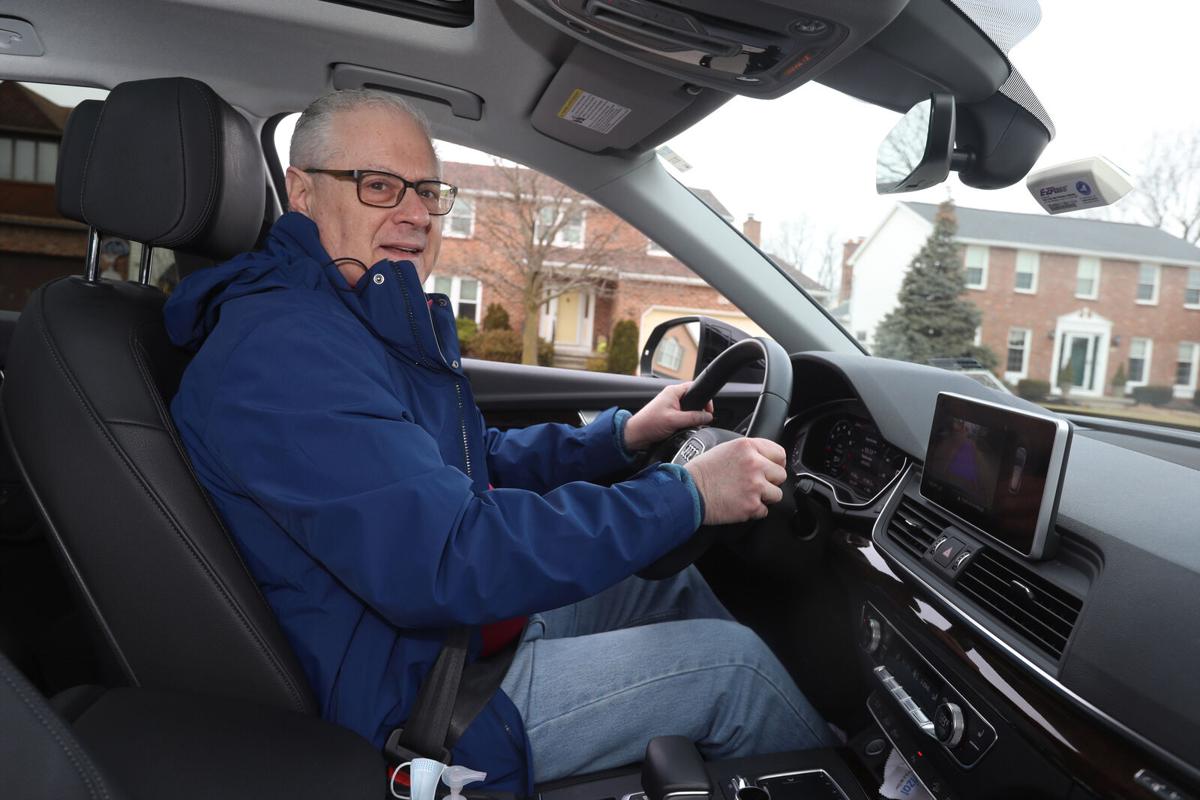 Keith Bookbinder, hospitalized with a traumatic brain injury last March, is again behind the wheel of his 2019 Audi Q5, after the Erie County Medical Center Driver Rehabilitation Program gave him the green light to resume driving.  John Hickey/Buffalo News