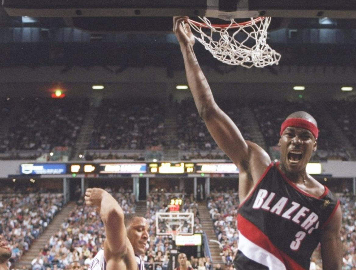 NBA player Cliff Robinson with Blazers uniform, grabbing rim