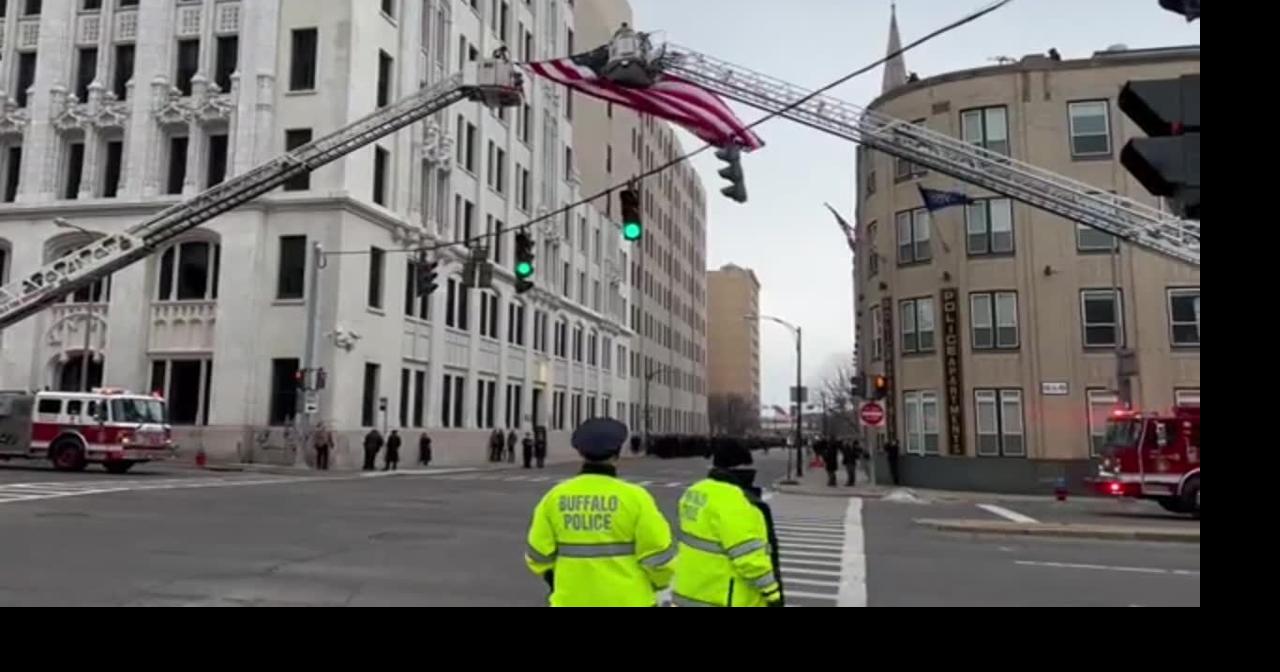 American flag hangs over Church Street for funeral procession for Jason