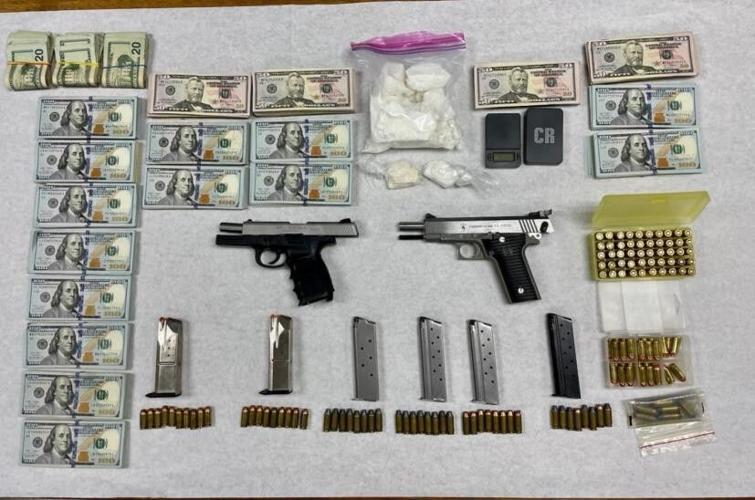 Guns, ammunition, drugs and cash seizure