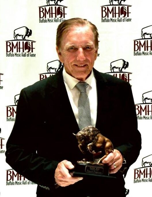 Chuck Anderson, 75, prominent auctioneer with an abiding love of music