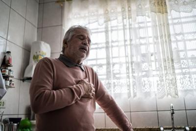 Senior man feeling pain at home