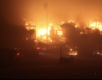 The Palisades Fire burning a structure on January 8