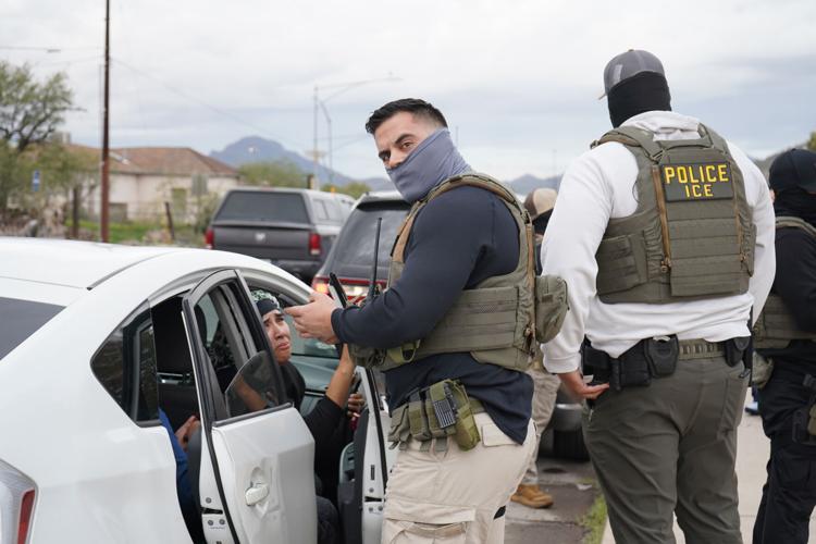 ice agent stares down camera