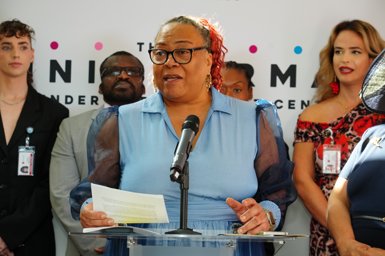 Queen Chela Demuir addressing the press.