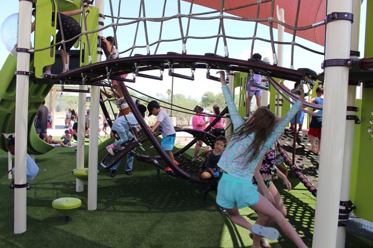 girl on monkey bars, tucson park