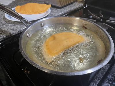 Frying empanadas
