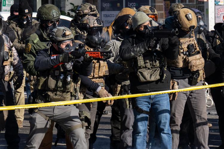 Officers with less lethal launchers, Minneapolis