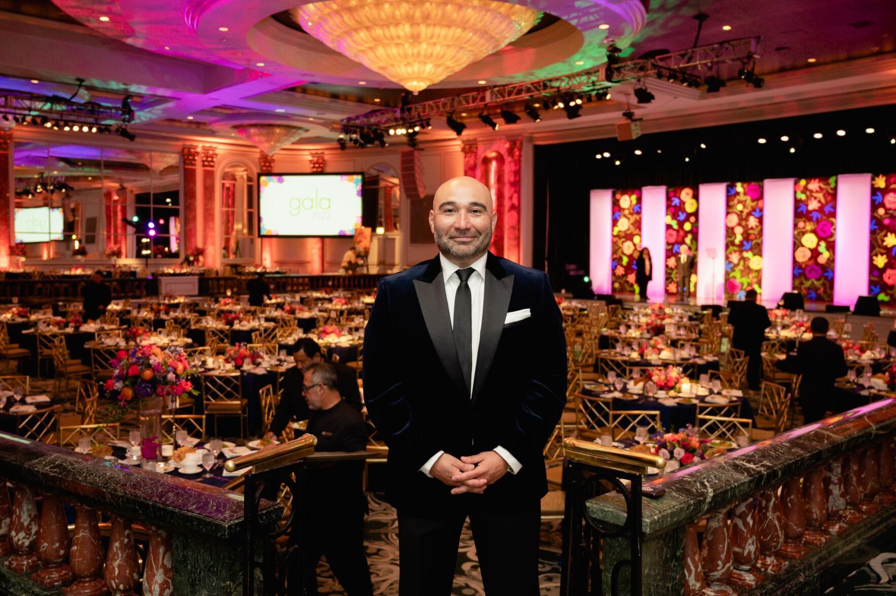 1) AHWM Charitable Foundation President Juan De La Cruz stands before crew members who set up for the hospital’s 2022 gala, the first gathering since 2019. (Photo courtesy of AHWM Charitable Foudation)