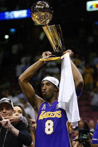 Kobe Bryant June 12, 2002 - Los Angeles Kobe Bryant holds the NBA championship  trophy in the