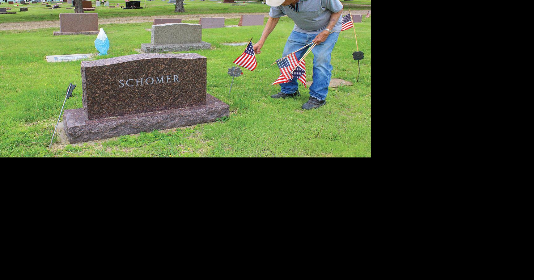 Soldier puts flags up in honor of Memorial Day News