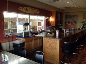Sandbar Lounge with open window access to the River Front Patio