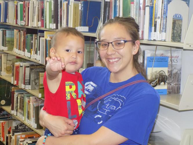 Families prepare to read in a summer key at Rawlins Municipal Library