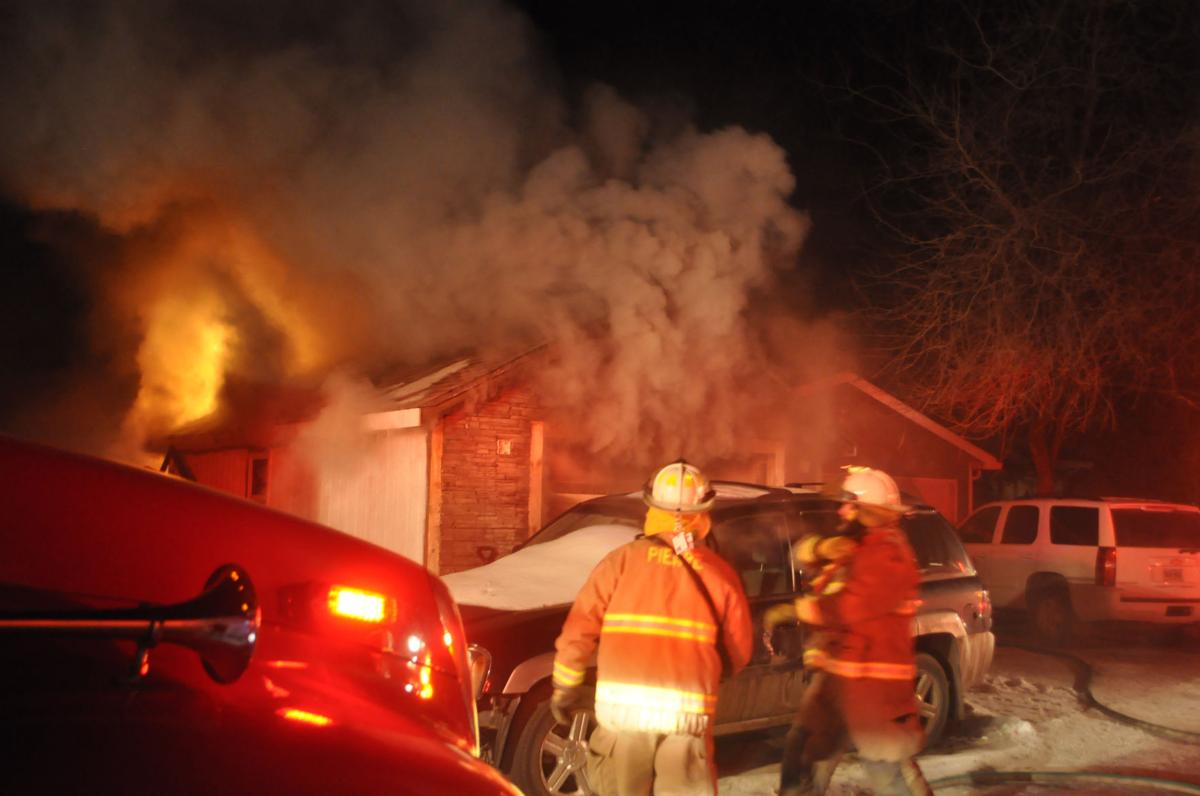 UPDATED Fire in frigid night damages garage behind Pierre home near