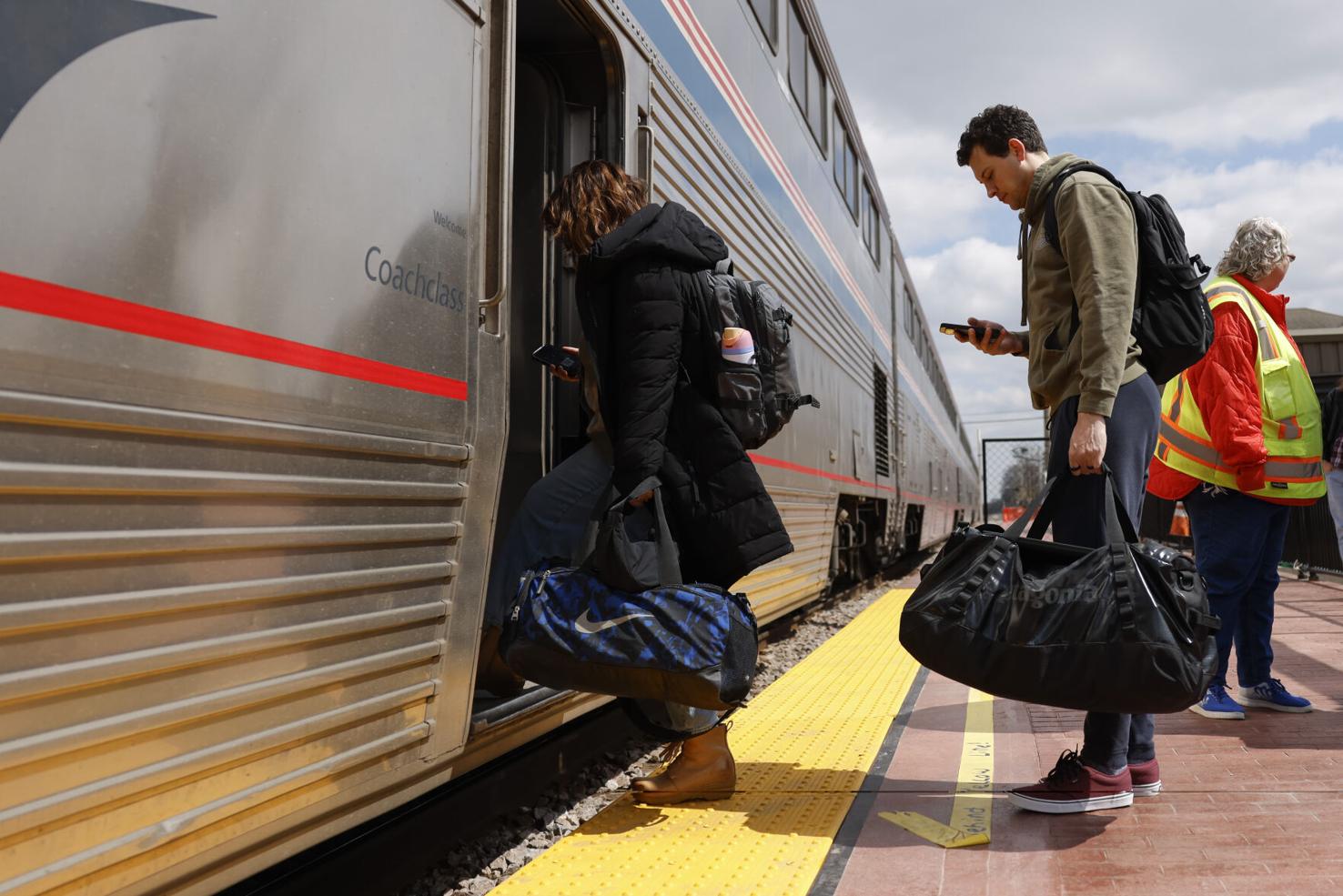 Passengers board the Amtrak Borealis train at the Columbus train station