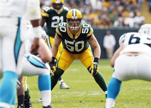 Green Bay Packers linebacker A.J. Hawk (L) and cornerback Charles