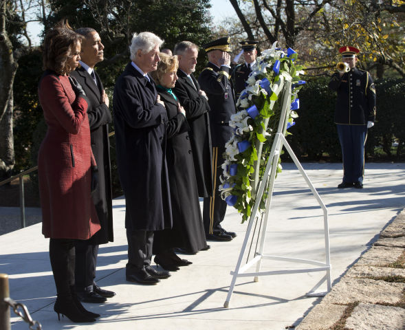 St. Louis Cardinals - Family members pause to lay a wreath at the