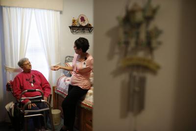 Nurse Sandy Miller, right, chats July 19 with patient Martha Hays (copy)