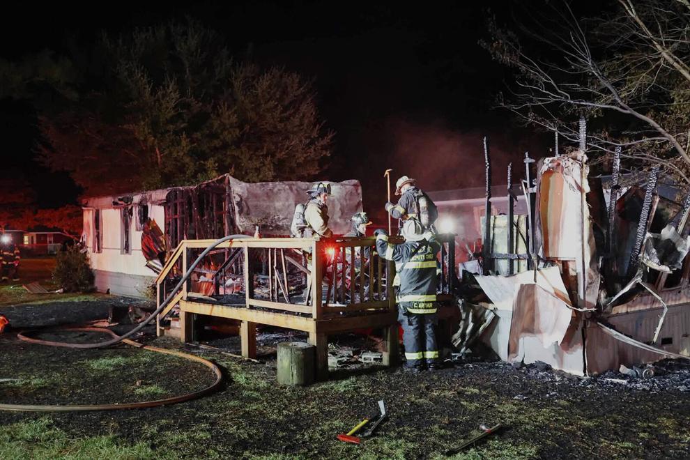 Two escape as fire destroys Morehead City mobile home