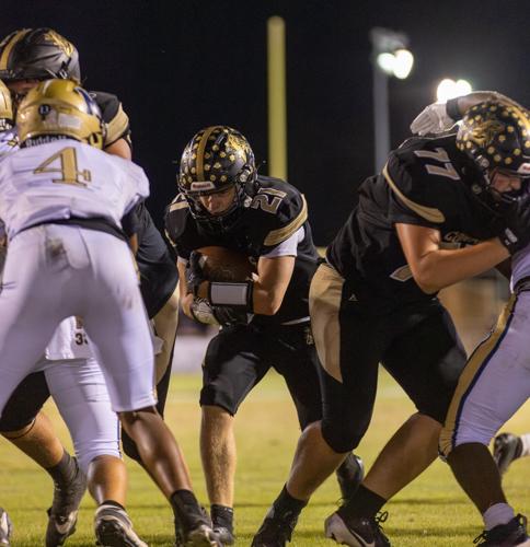 Cougars’ unbeaten run ends in 30-28 battle with Monarchs