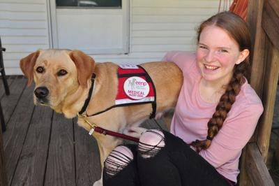 Mill Creek girl navigates epilepsy with help from canine companion