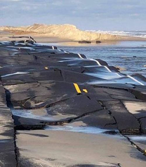 Storm surge buckles Highway 12