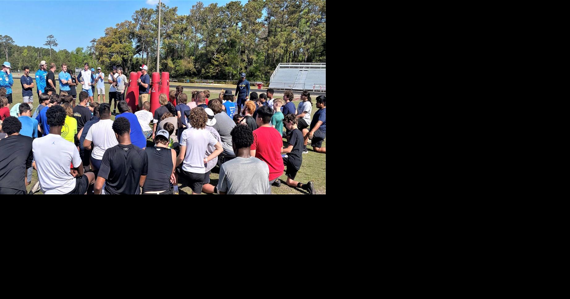 College players bring knowledge, knowhow to first football camp by