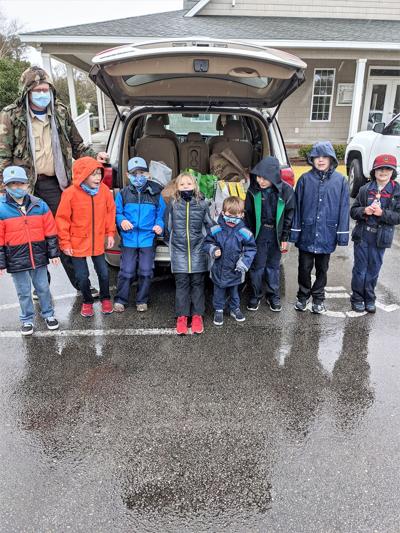Scouts weather rainy conditions during food pickup