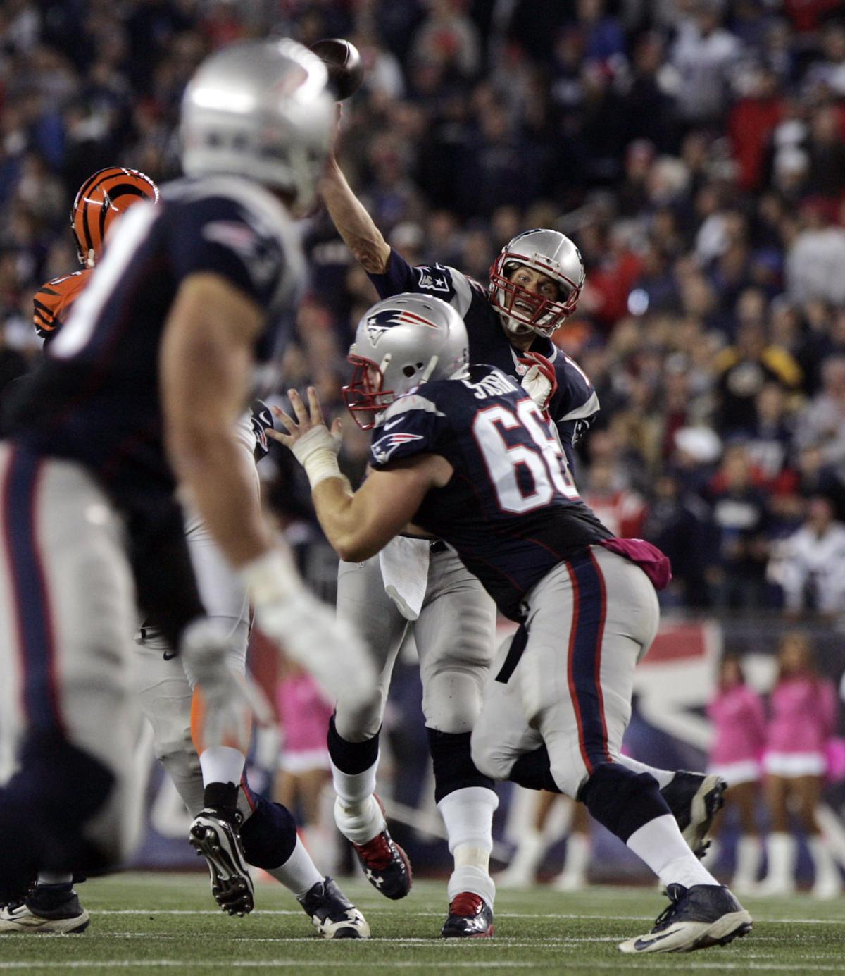 New England Patriots quarterback Tom Brady rifles a pass over the middle to tight end Rob Gronkowski at the end of the second quarter of play.