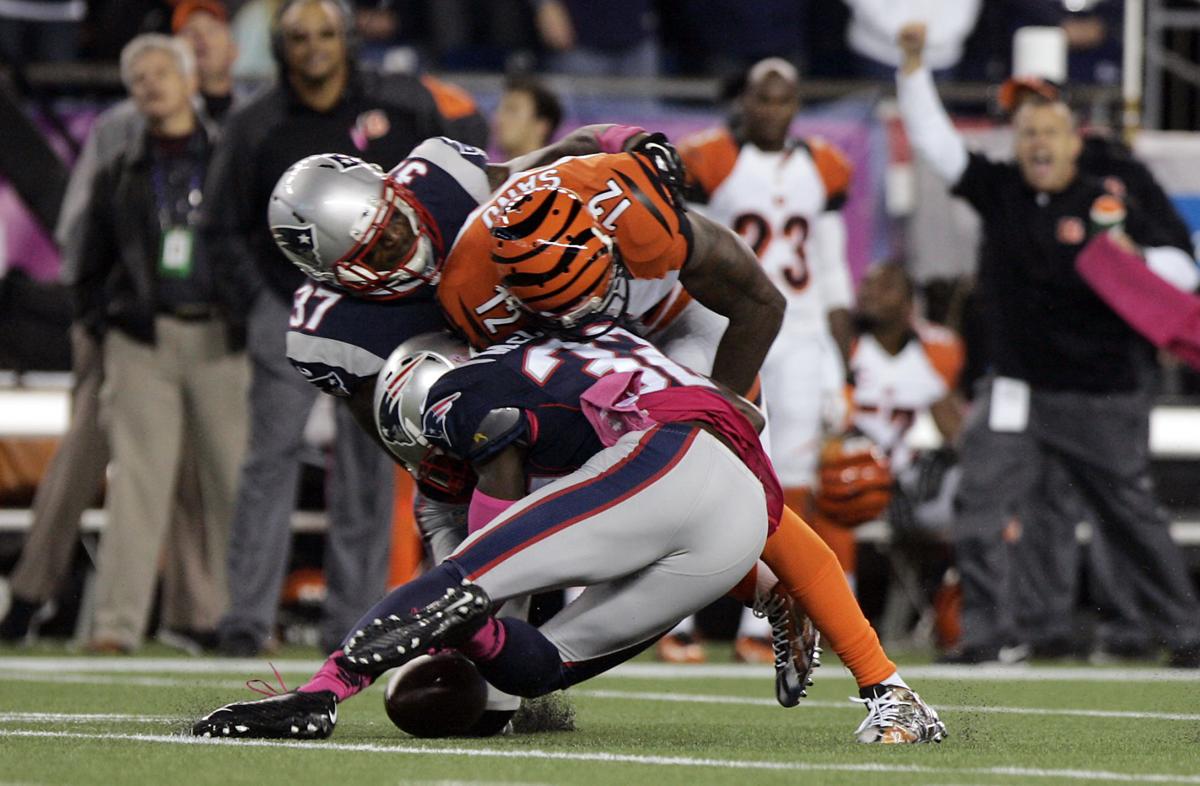New England Patriots cornerback Alfonzo Dennard (37) and safety Devin McCourty (32) combine for a big hit on Cincinnati Bengals wide receiver Mohammed Sanu (12) dislodging the ball for an incomplete pass.