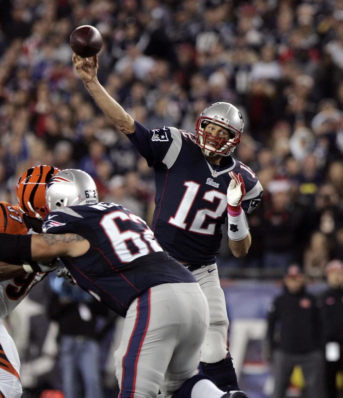 New England Patriots quarterback Tom Brady fires a pass over the middle against Cincinnati on Sunday evening.