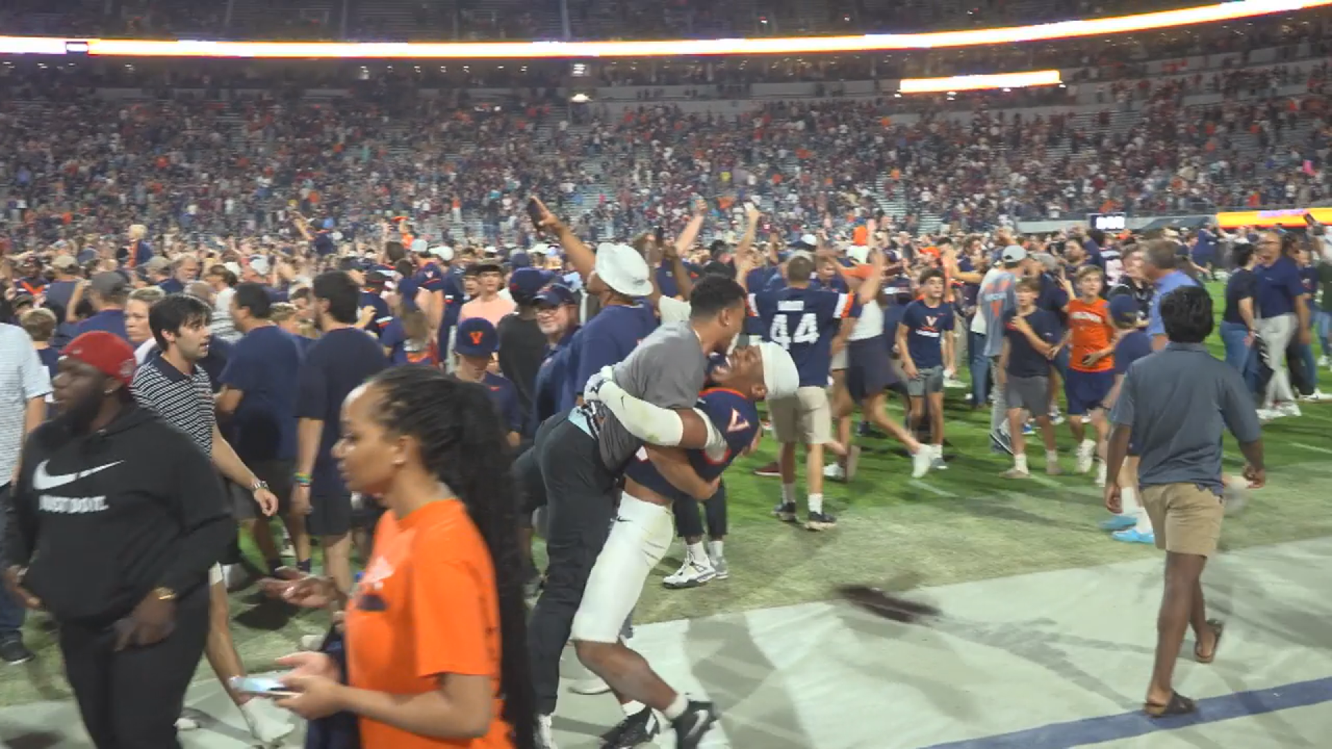 UVA fined after field storming, 19 treated for injuries; Hoos crack AP Top 25