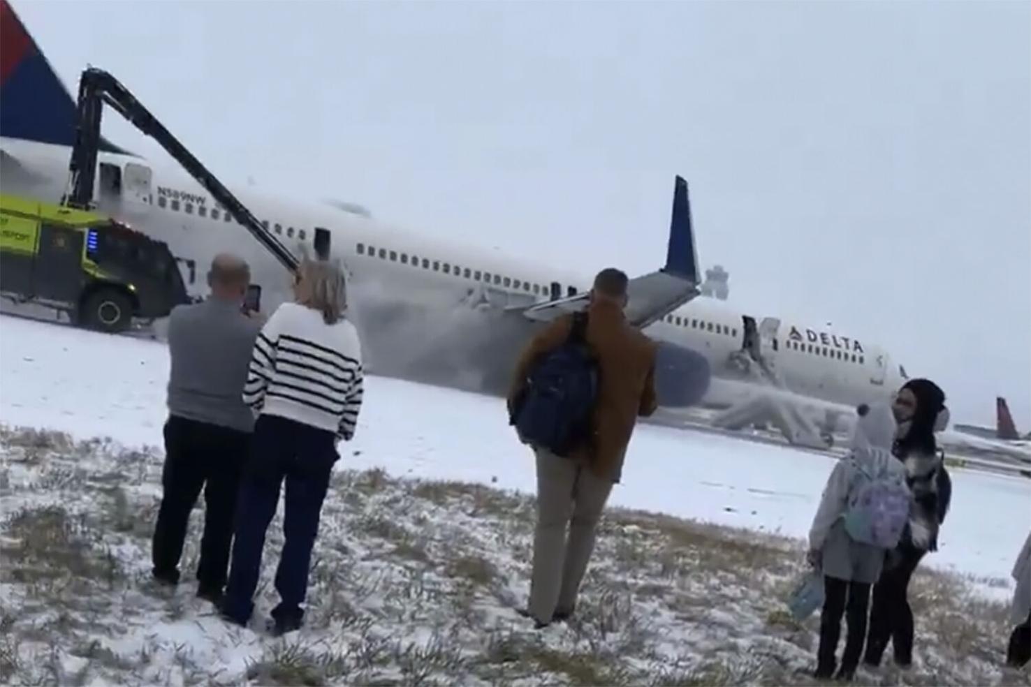 Delta Airlines plane flips on landing in Toronto and a badly hurt child