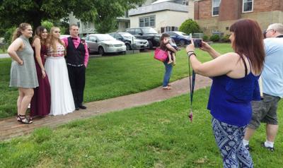 Prom-bound students pose for photos in Pell Garden | Local News ...