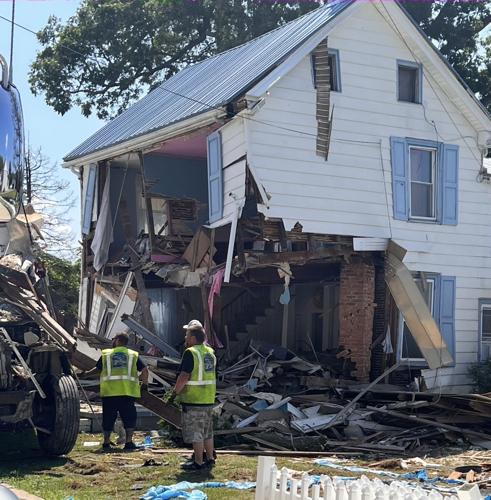 Truck crashes into house